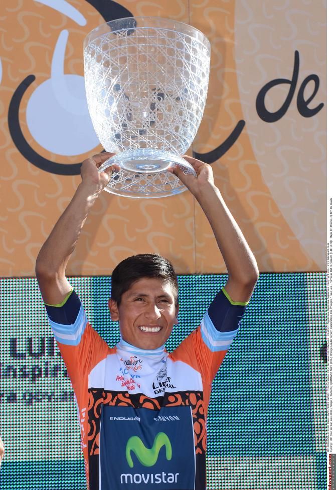 Nairo Quintana (Movistar) lifts the hige winner's trophy