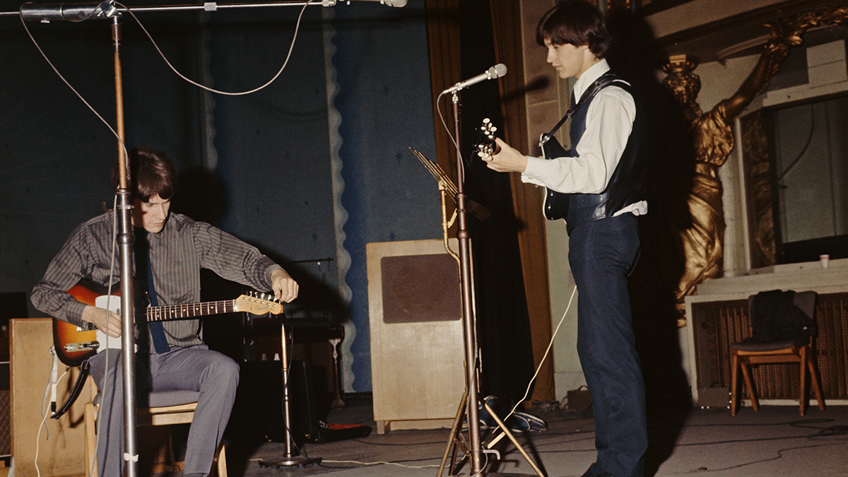 Ray Davies (left) and his brother Dave Davies, of The Kinks, at a soundcheck before a session for the BBC at the Playhouse Theatre, London, 7th September 1964.