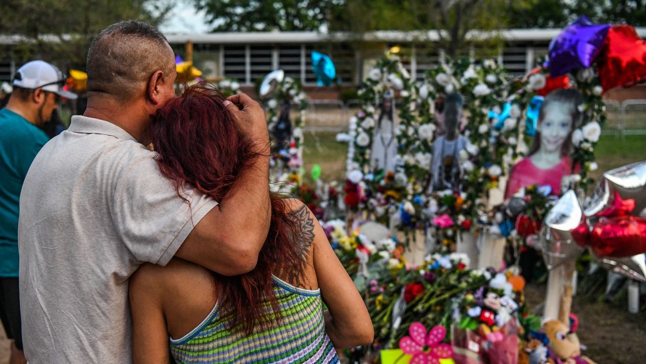 Mourners pay tribute outside Robb Elementary School, Uvalde