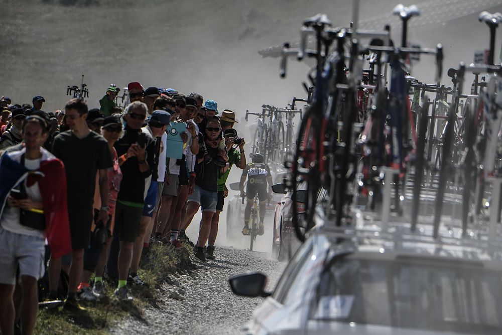 The dust kicks up on the dirt roads during stage 10 at the Tour de France