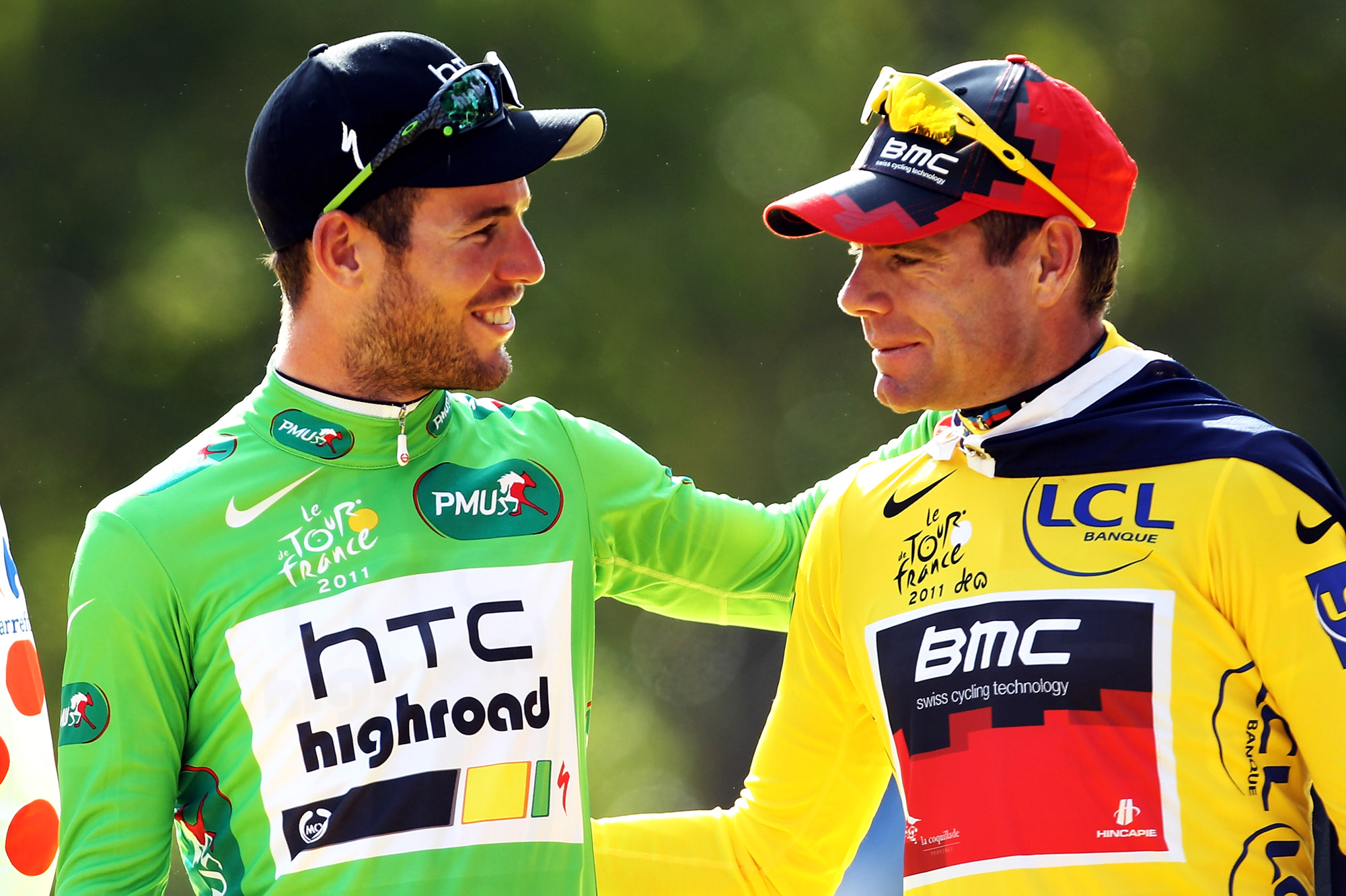 PARIS, FRANCE - JULY 24:  Green Jersey winner Mark Cavendish (L) of team HTC celebrates on the podium with yellow jersey winner Cadel Evans of team BMC after the twenty first and final stage of Le Tour de France 2011, from Creteil to the Champs-Elysees in Paris on July 24, 2011 in Paris, France.  (Photo by Bryn Lennon/Getty Images)