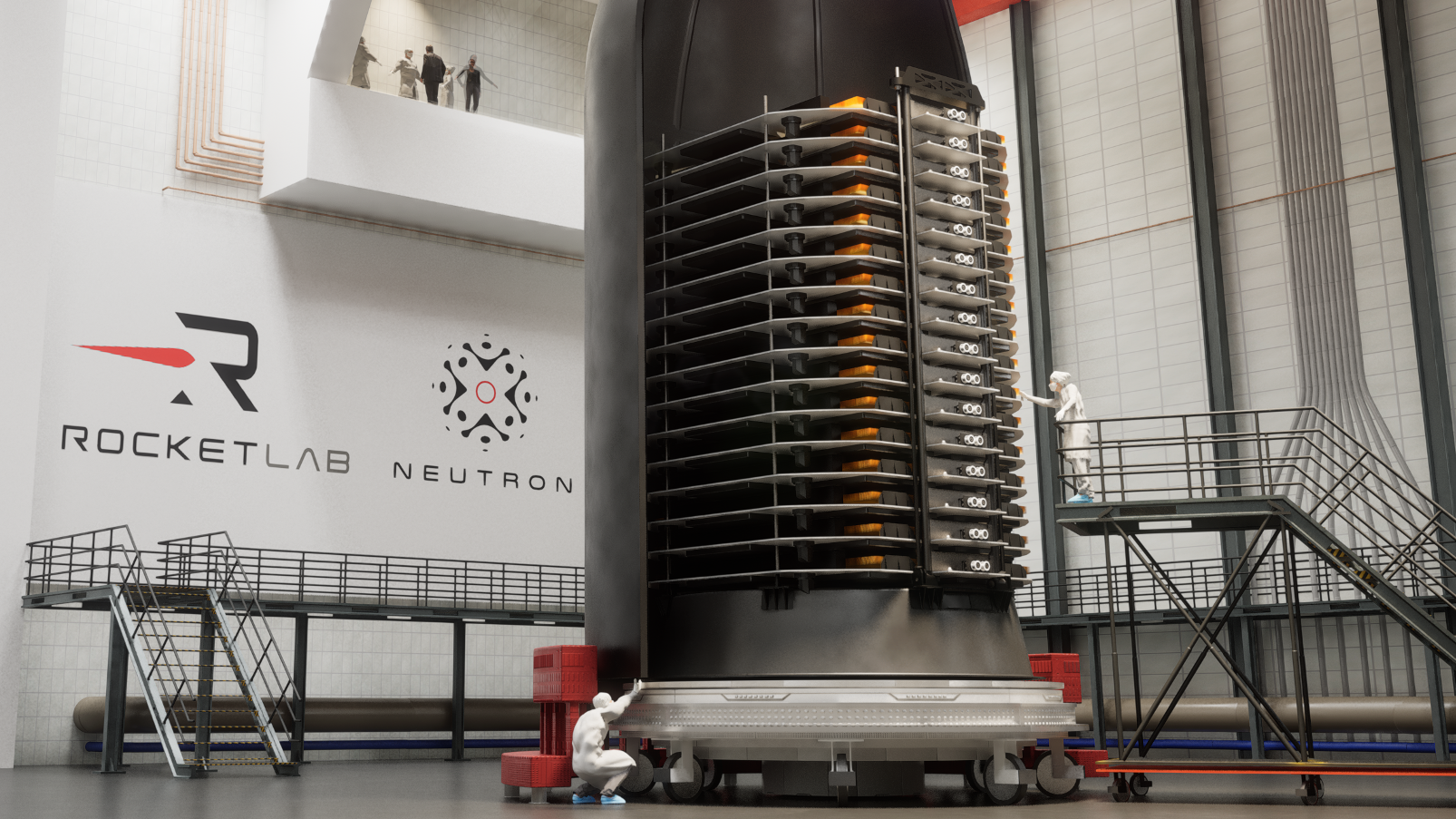 A stack of thin satellites sits in half a rocket fairing in a clean room. 