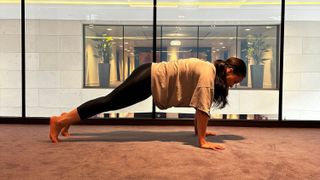 Personal trainer Aimee Victoria Long performing plank rocks