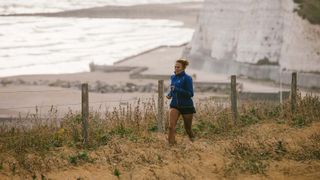 Woman running on English coast