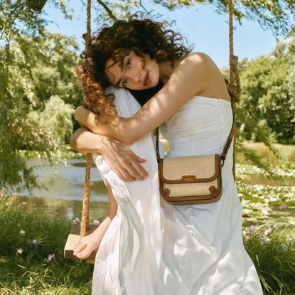 Aspinal of London model with raffia crossbody bag