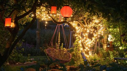 string light ideas: in tree with hanging egg chair