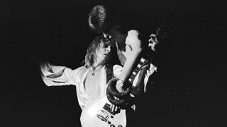 David Bowie and Mick Ronson live onstage in 1973.