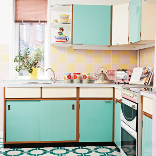 retro kitchen with turquoise cupboards and counter