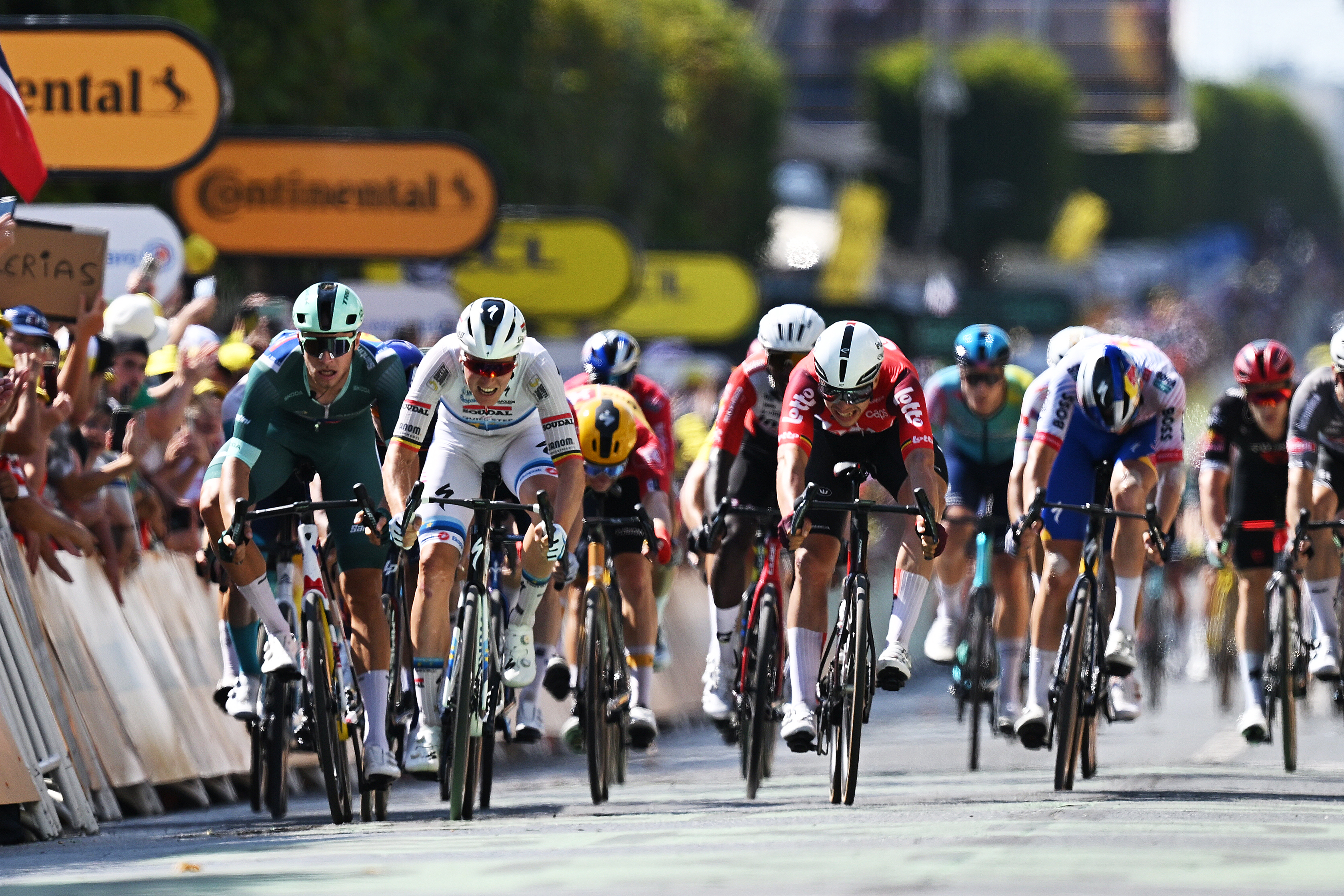 CHATEAUROUX, FRANCE - JULY 13: (L-R) Jonathan Milan of Italy and Team Lidl - Trek - Polka dot Mountain Jersey, Tim Merlier of Belgium and Team Soudal Quick-Step and Arnaud De Lie of Belgium and Team Lotto sprint at finish line during the 112th Tour de France 2025, Stage 9 a 174.1km stage from Chinon to Chateauroux ) / #UCIWT / on July 13, 2025 in Chateauroux, France. (Photo by Tim de Waele/Getty Images)