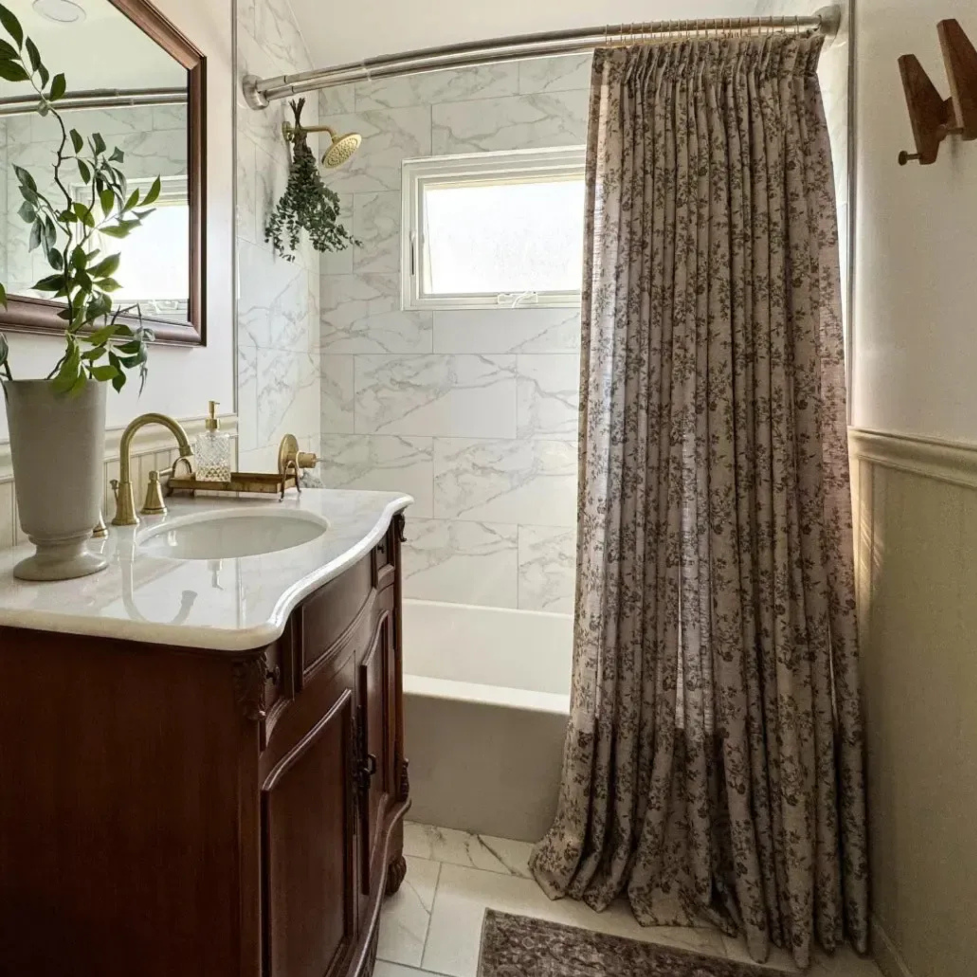 a bathroom with a floral printed shower curtain