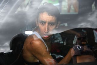 Egan Bernal sits in an Ineos team after the stage was cancelled