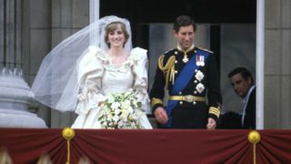 Princess Diana and King Charles stand on the balcony of Buckingham Palace after their wedding