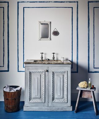 upcyled vanity unit in soft blue tones with faux painted wall panels and blue floor