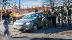Federal agents pepper spray a protester in Minneapolis, Minnesota.