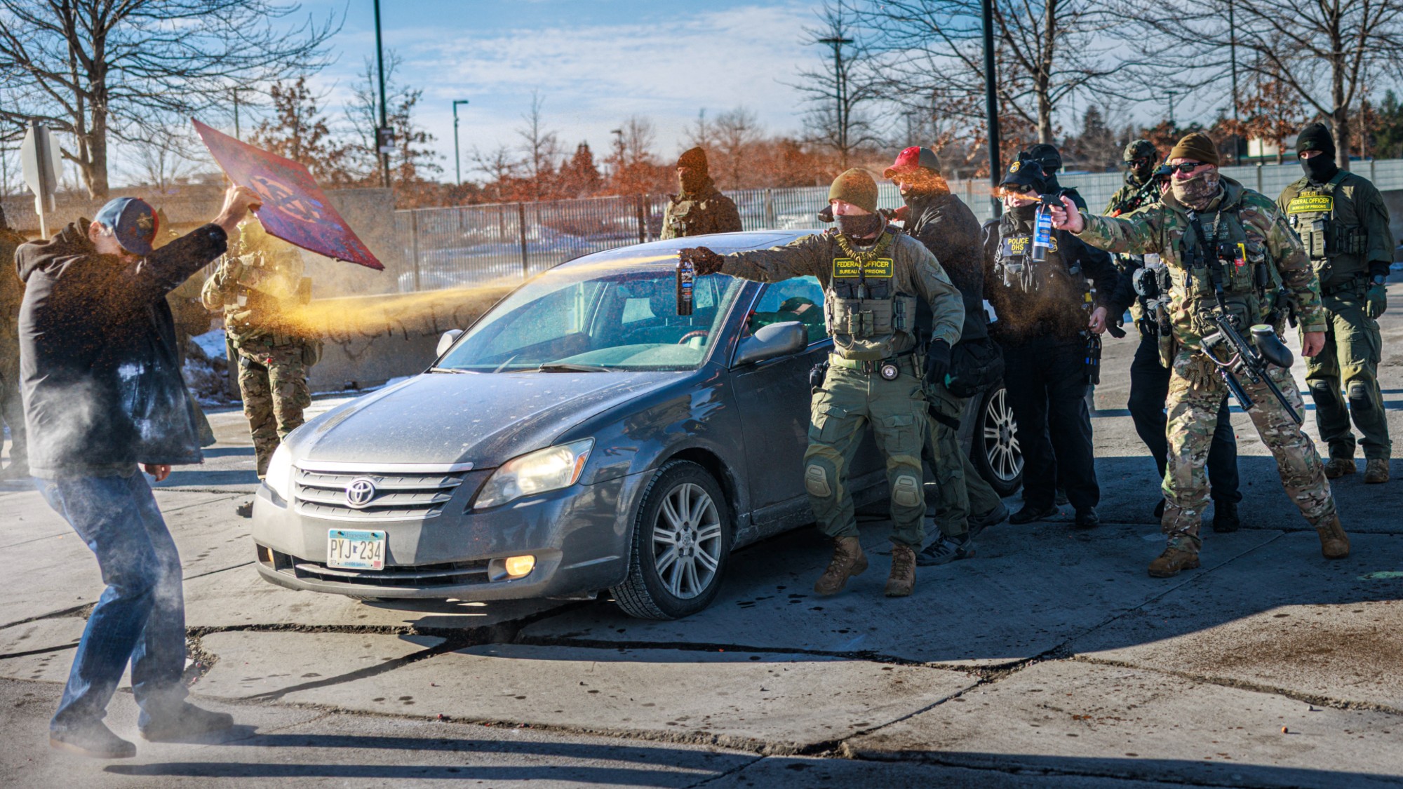 Federal agents pepper spray a protester in Minneapolis, Minnesota.