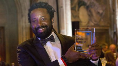 LONDON, ENGLAND - OCTOBER 13:Author Marlon James winning author of "A Brief History of Seven Killings", poses with his awardat the ceremony for the Man Booker Prize for Fiction 2015 at The Gu