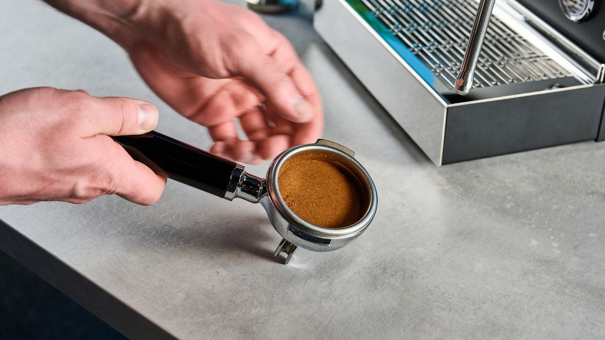 The Diletta Mio espresso machine portafilter with coffee inside