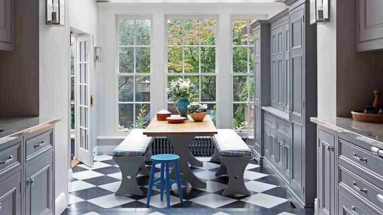 Black and white checkerboard flooring in kitchen