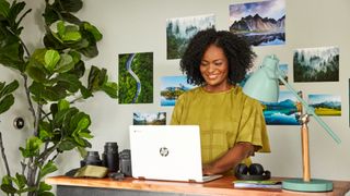 Woman using HP 2-in-1 at a standing desk
