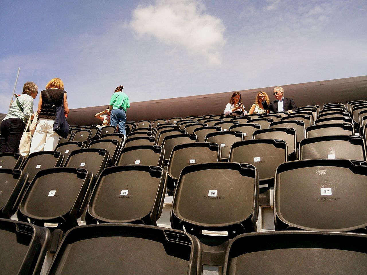 Sample image taken with Camp Snap 2 digital compact camera, showing people sitting in stadium stand seats