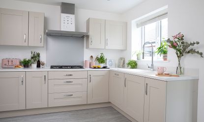 cream shaker kitchen with chrome handles pink pots ceramic sink chrome tap herbs