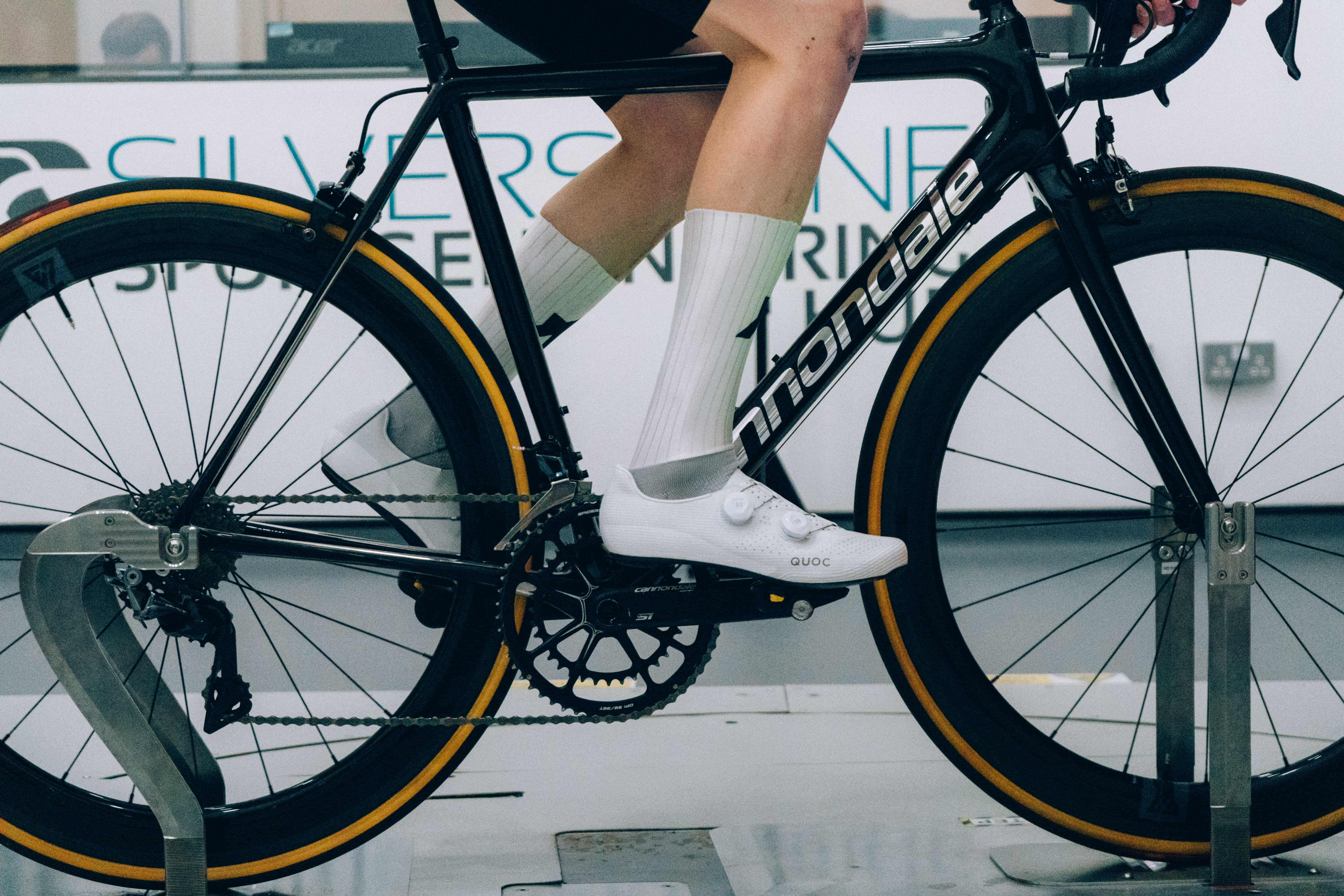 A close up of the socks that Tom is wearing while riding a bike in the wind tunnel