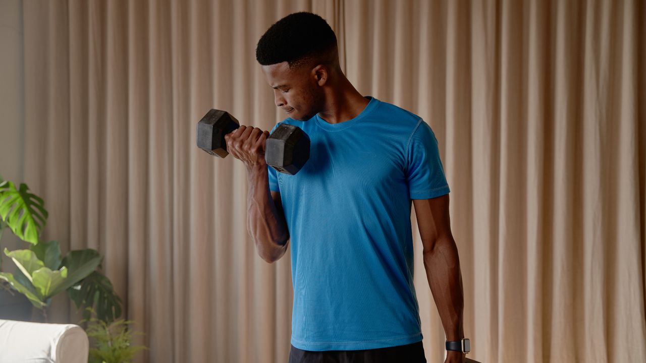 Man performing dumbbell bicep curls