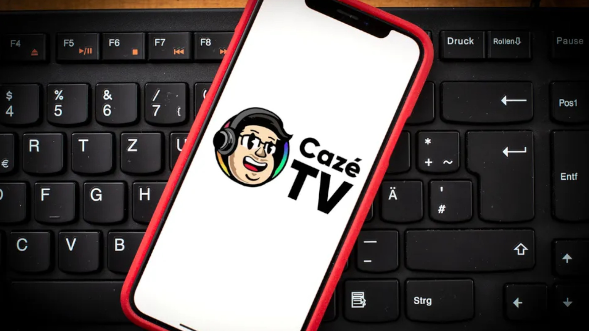 Image of an iPhone with CazeTV logo on the screen
