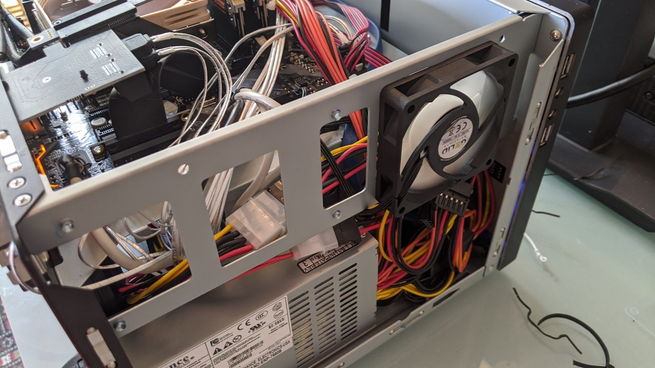 The classic "cram all the excess cables into a tiny space" method.