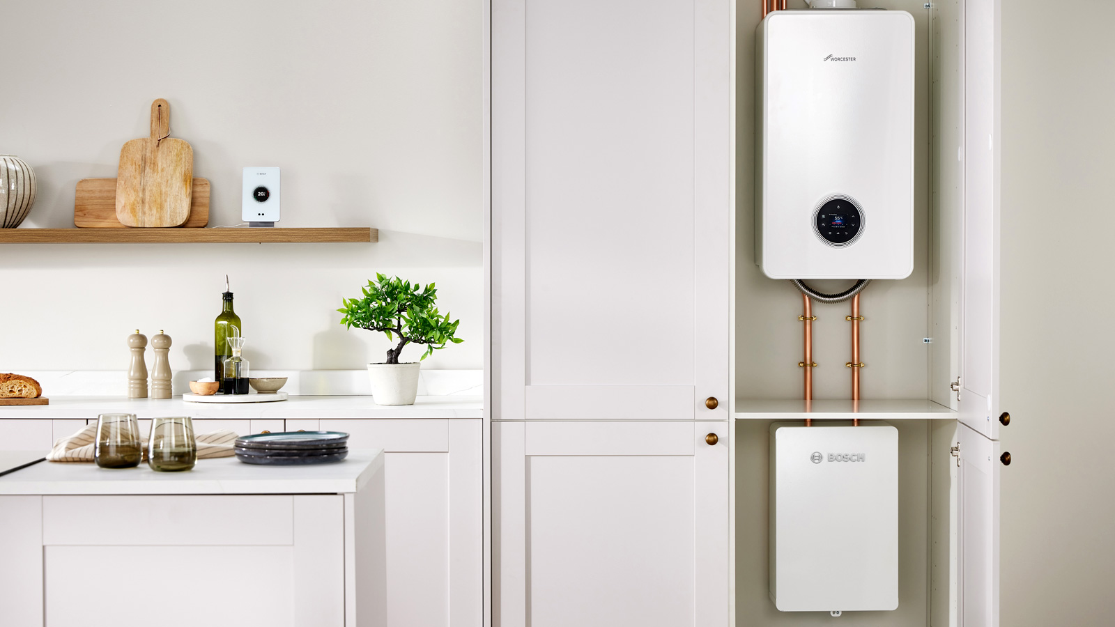 Worcester Bosch Hybrid Heating System in cupboard on contemporary cream kitchen
