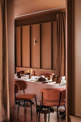 A dining room drenched in all pink