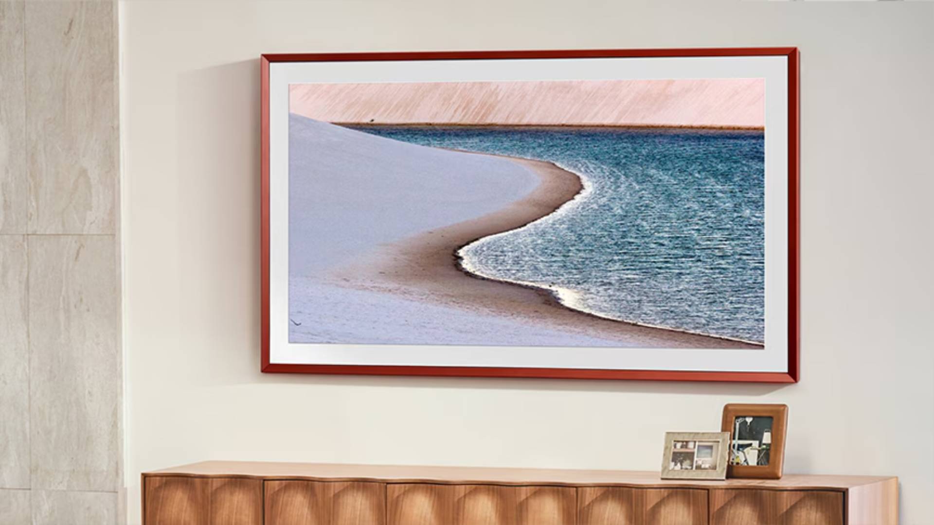 Samsung The Frame TV mounted to wall with beach on screen