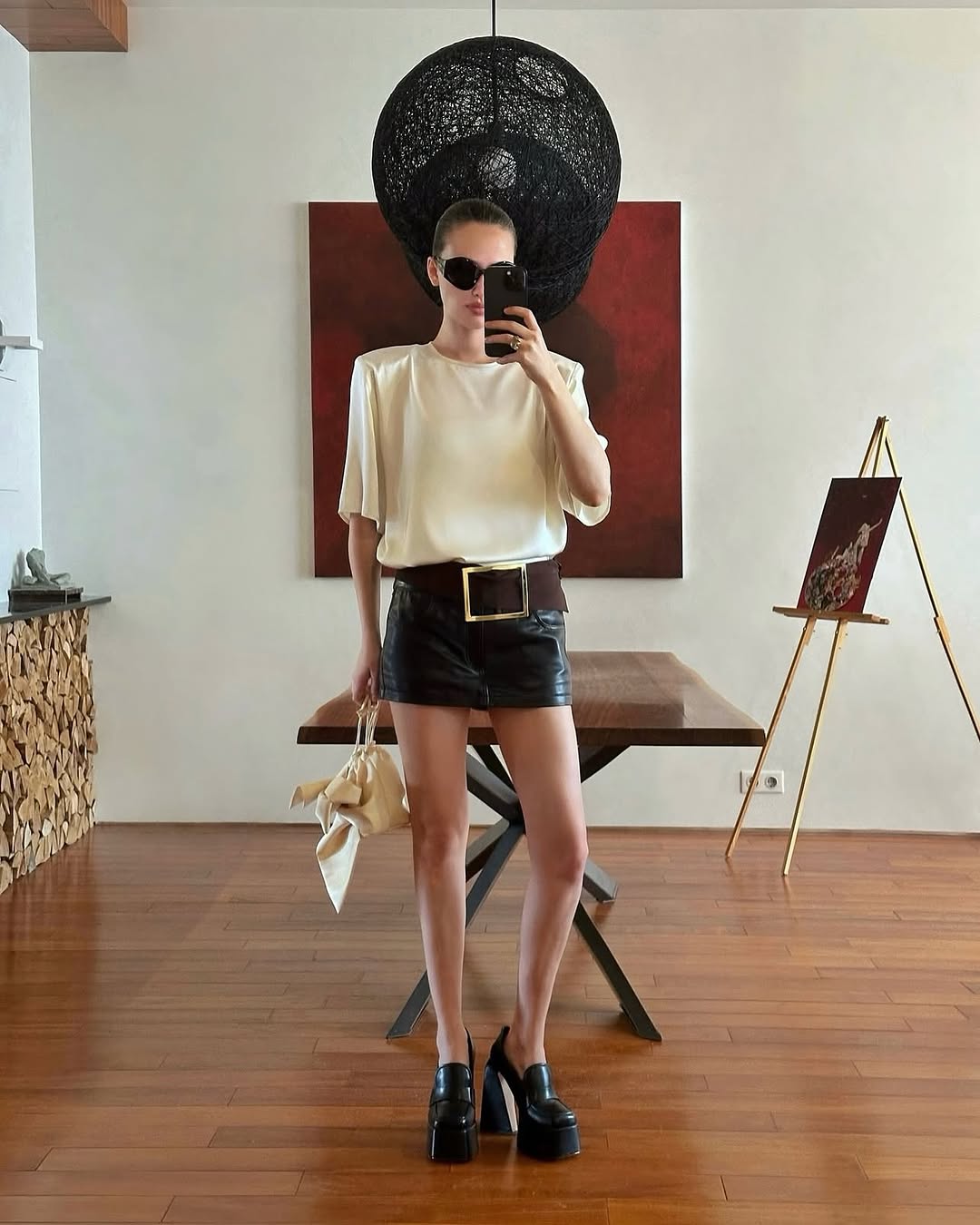 Woman wearing a super-mini black skirt.