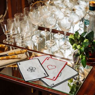 Rebecca Udall bar cart with glasses and cocktail napkins