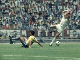 Brazil's Clodaldo competes for a ball with England's Bobby Charlton at the 1970 World Cup.