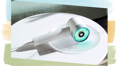 The Zuvi halo hair dryer, pictured on a white dish 