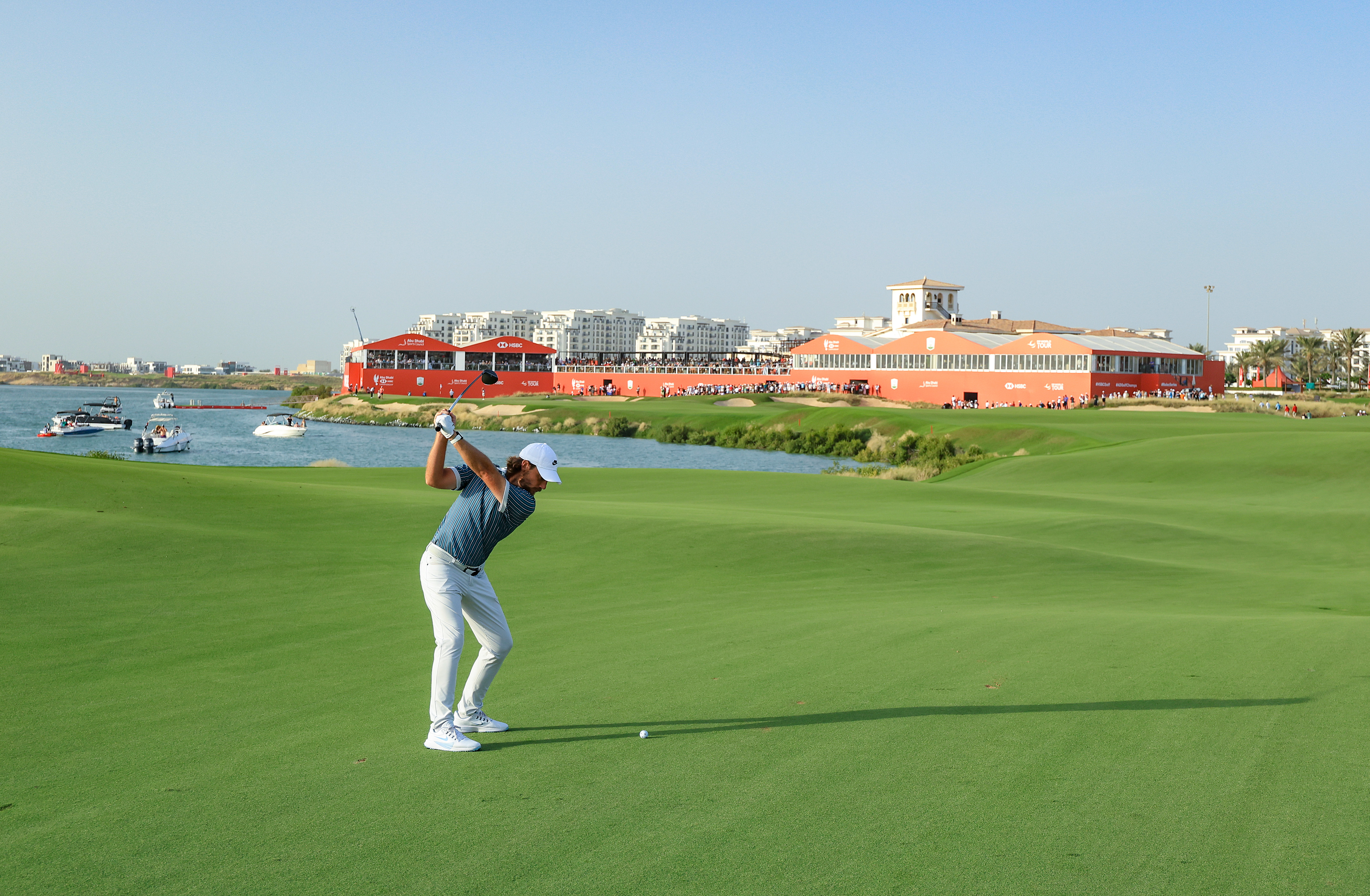 Tommy Fleetwood hits a shot from the fairway during the playoff in the 2025 Abu Dhabi HSBC Championship at Yas Links