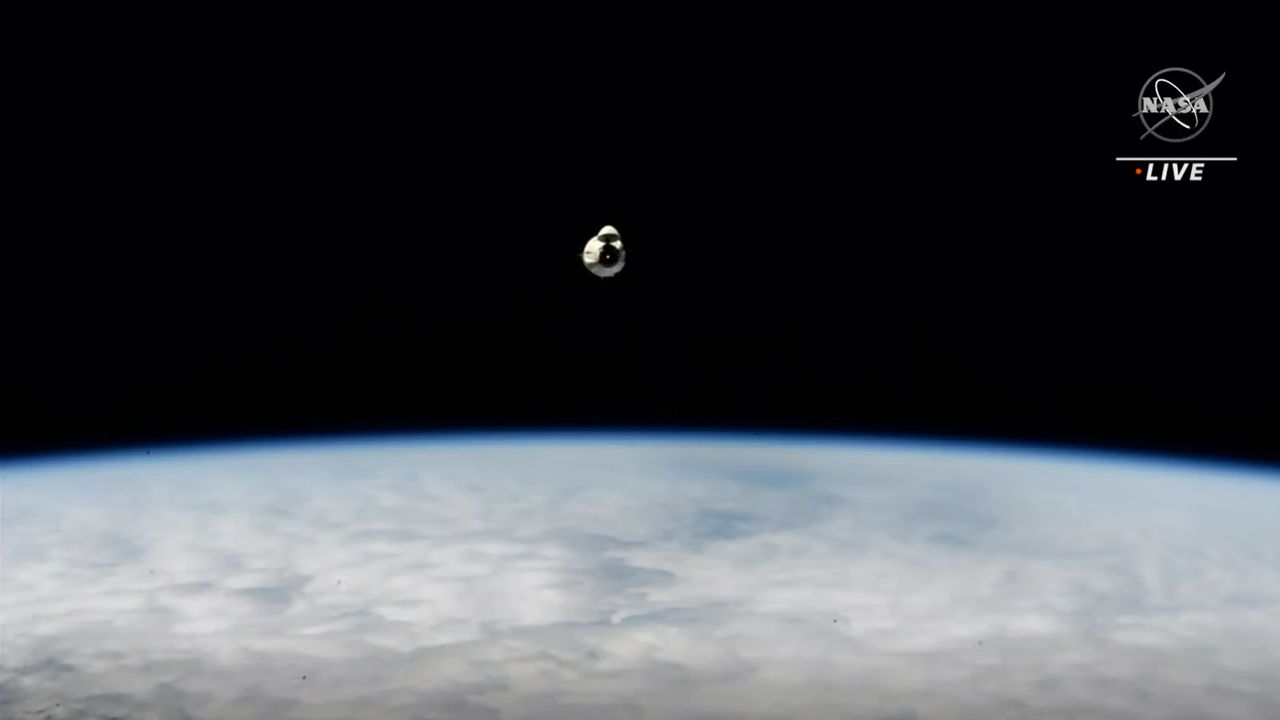 SpaceX's Crew-2 Dragon Endeavour is seen over a blue Earth in a view from the International Space Station after undocking on Nov. 8, 2021.