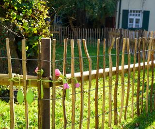 A simple fence made of sticks and wire