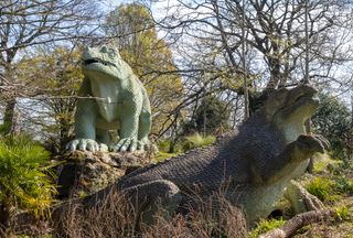 Two Iguanodon dinosaurs on an island in Crystal Palace Park