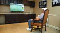 Rory McIlroy sat alone in a plush armchair watching a TV, following the end of the final round of the Players Championship of 2025 to see if he would be in a playoff
