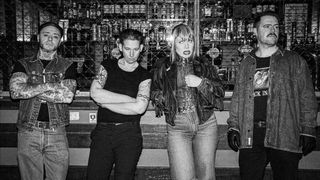 Split Dogs standing in a bar