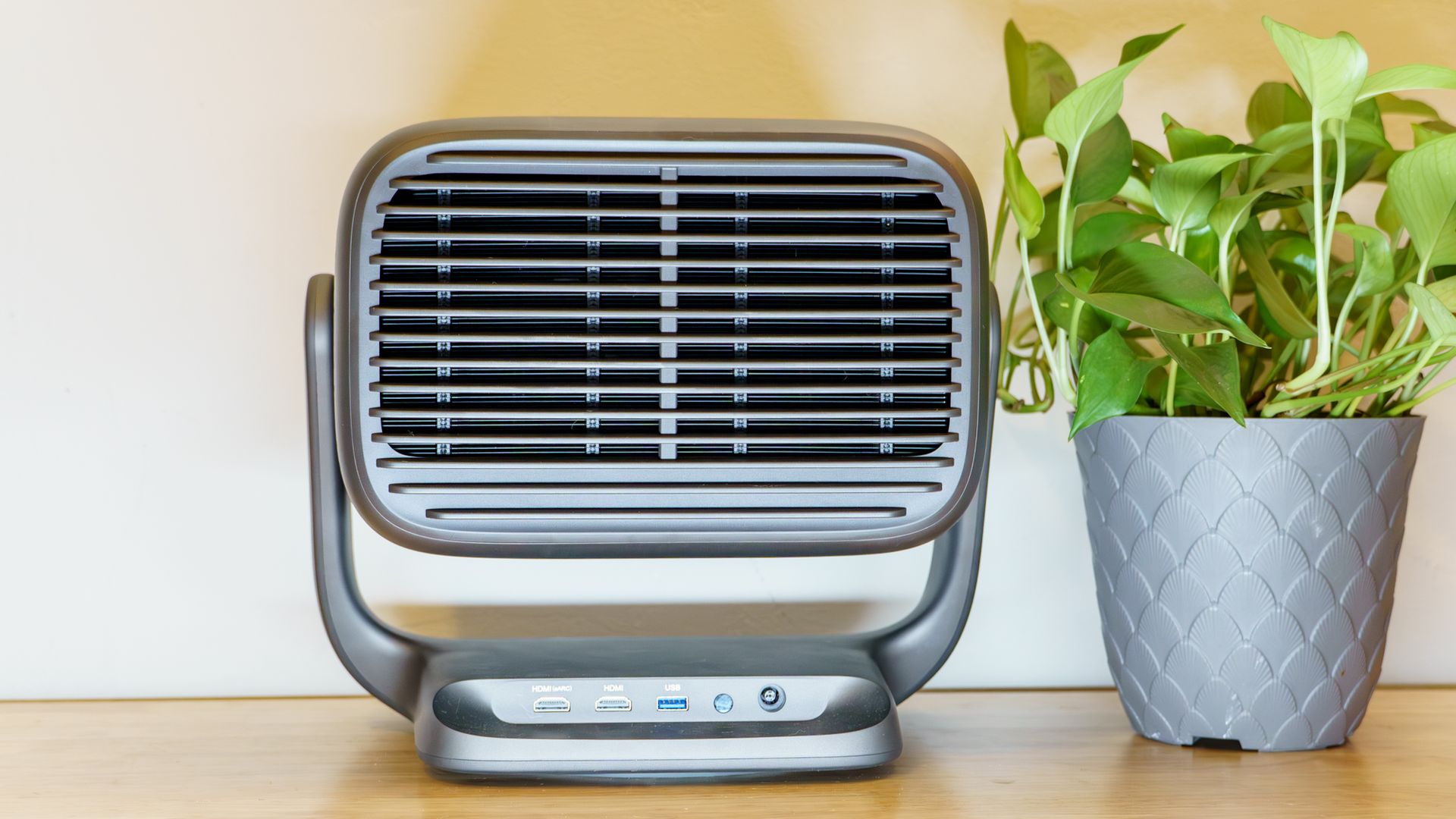 A JMGO N3 Ultimate projector on a desk