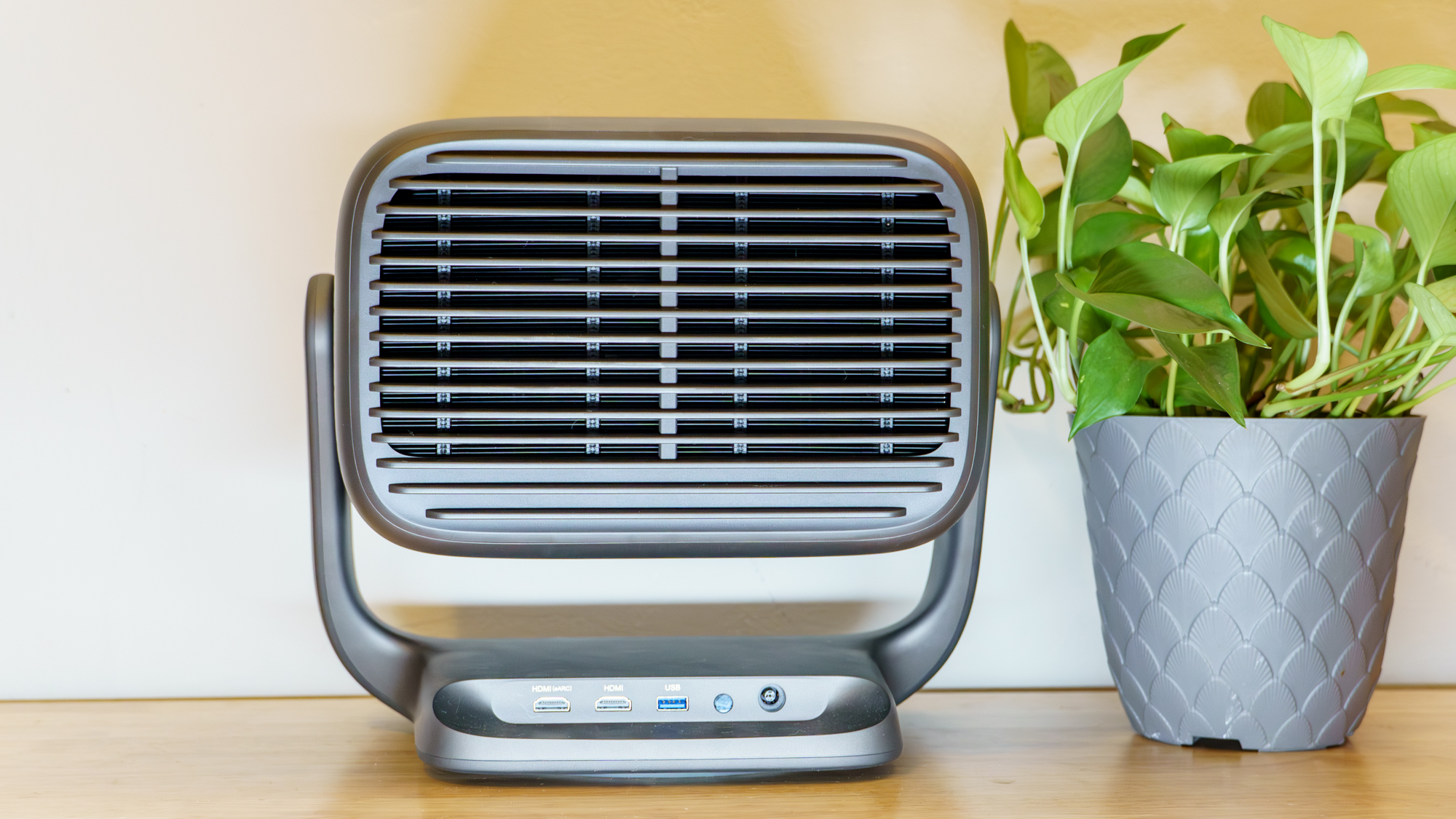 A JMGO N3 Ultimate projector on a desk