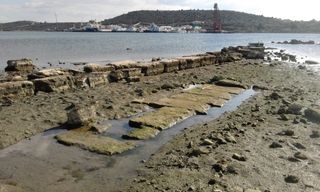 Part of the foundation of a structure built during the Classical period on the north side of the Bay of Ambelaki, where the military harbor was located.