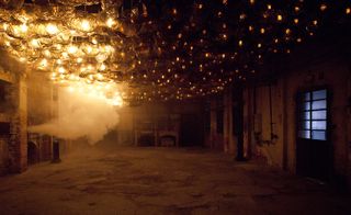 Empty factory with glass hanging from ceiling