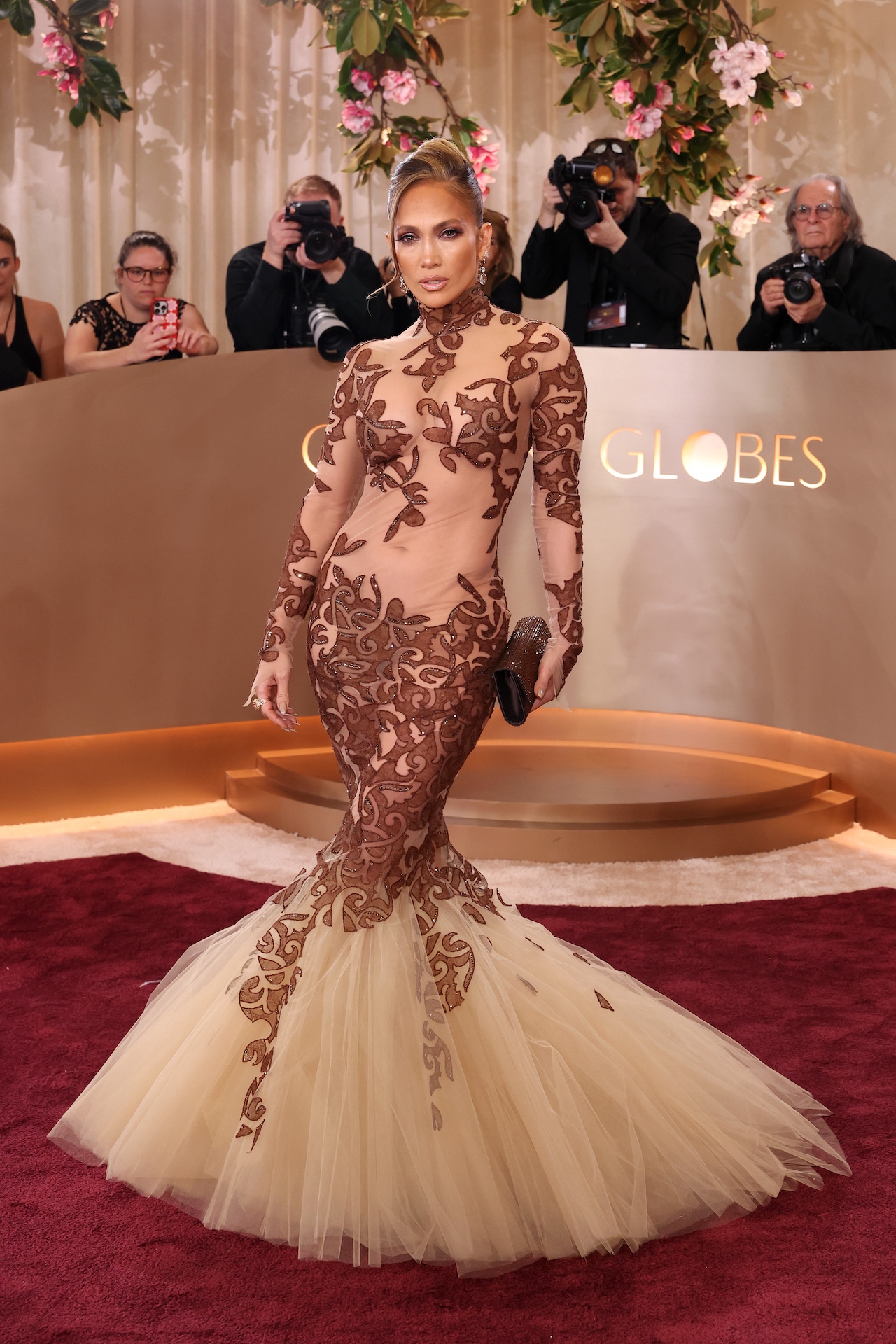 Jennifer Lopez posing in her sheer dress at the 2026 Golden Globes