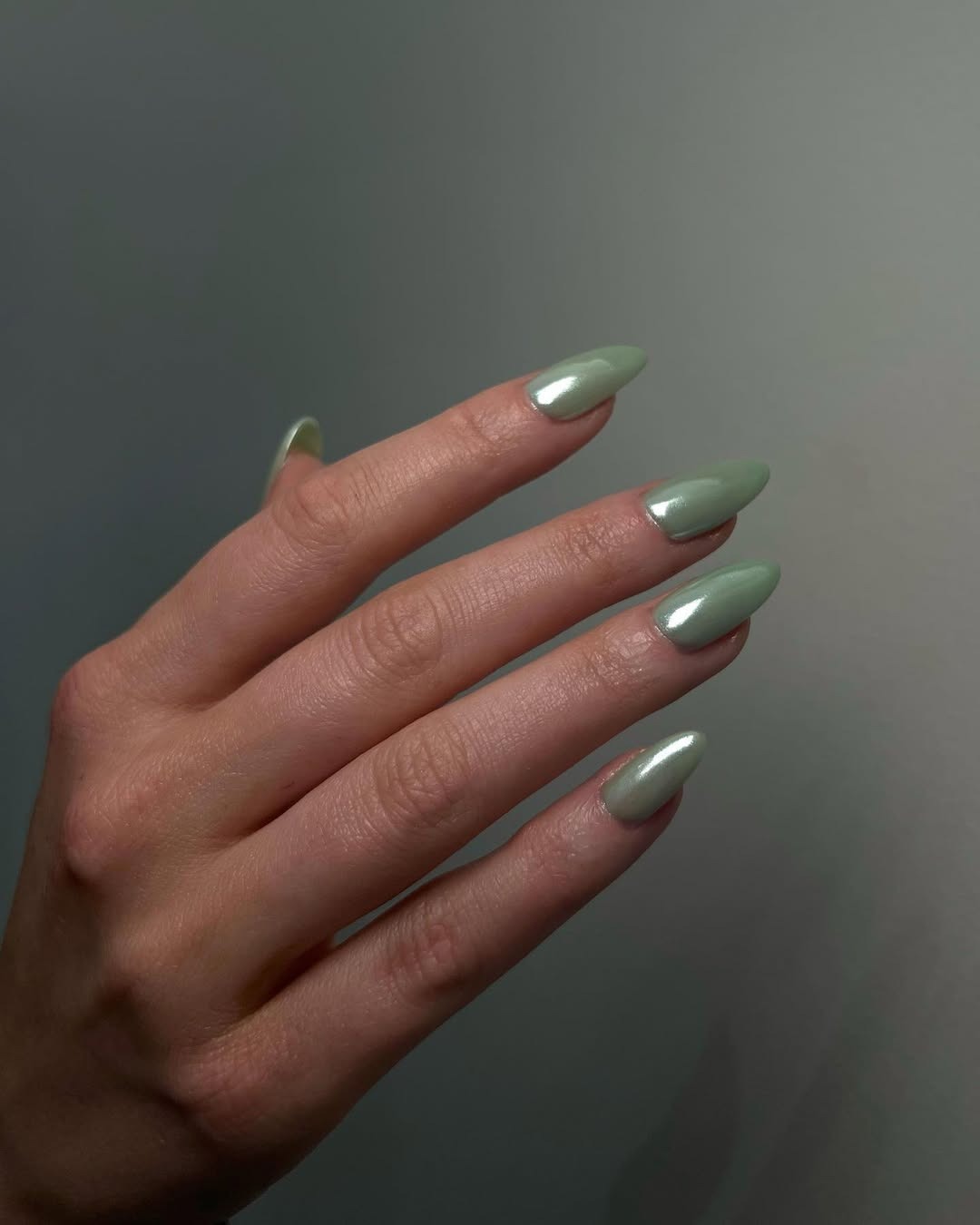 Glazed sage green nails.