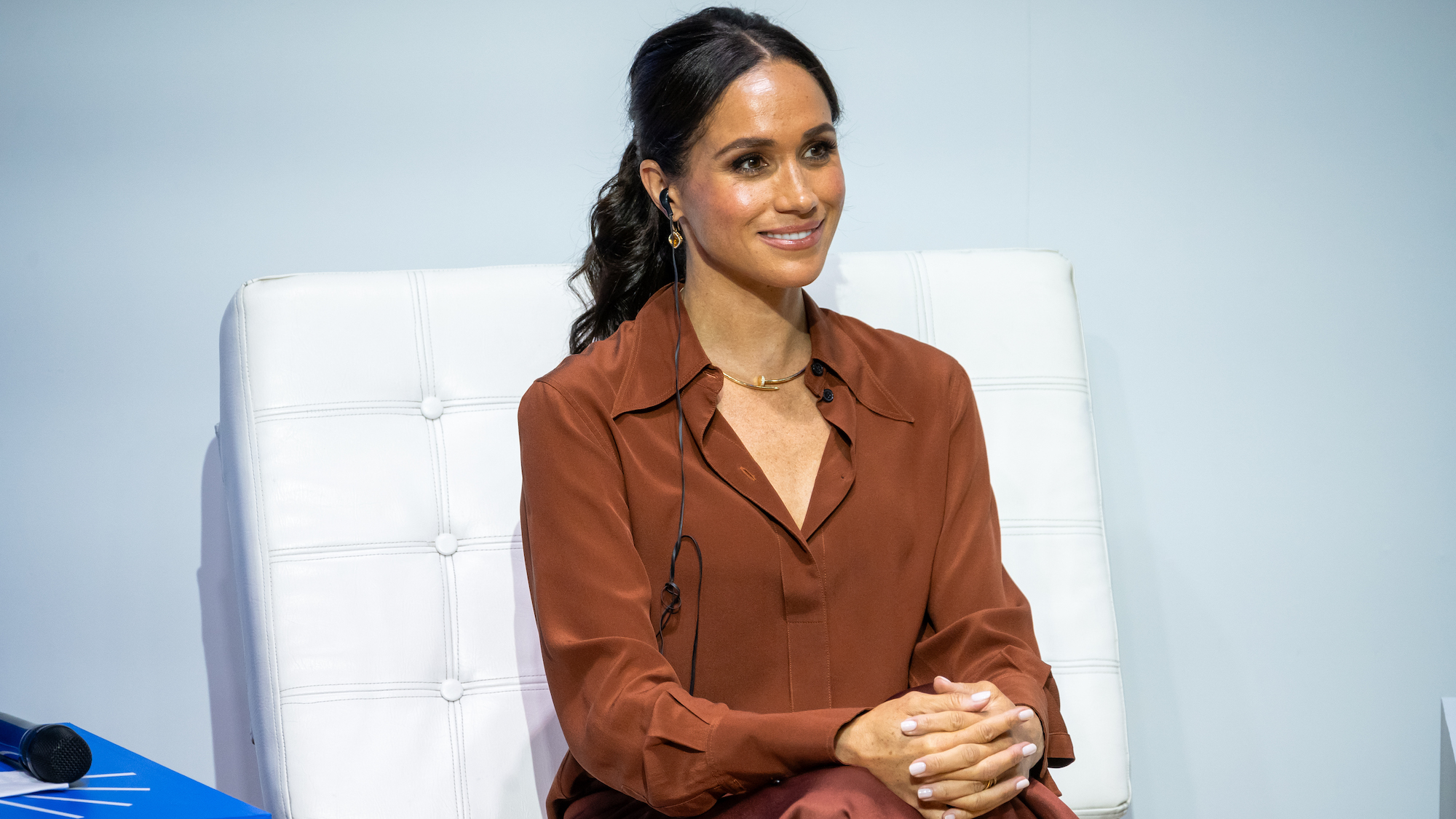 Meghan Markle wearing tan shirt with Montecito manicure on her nails