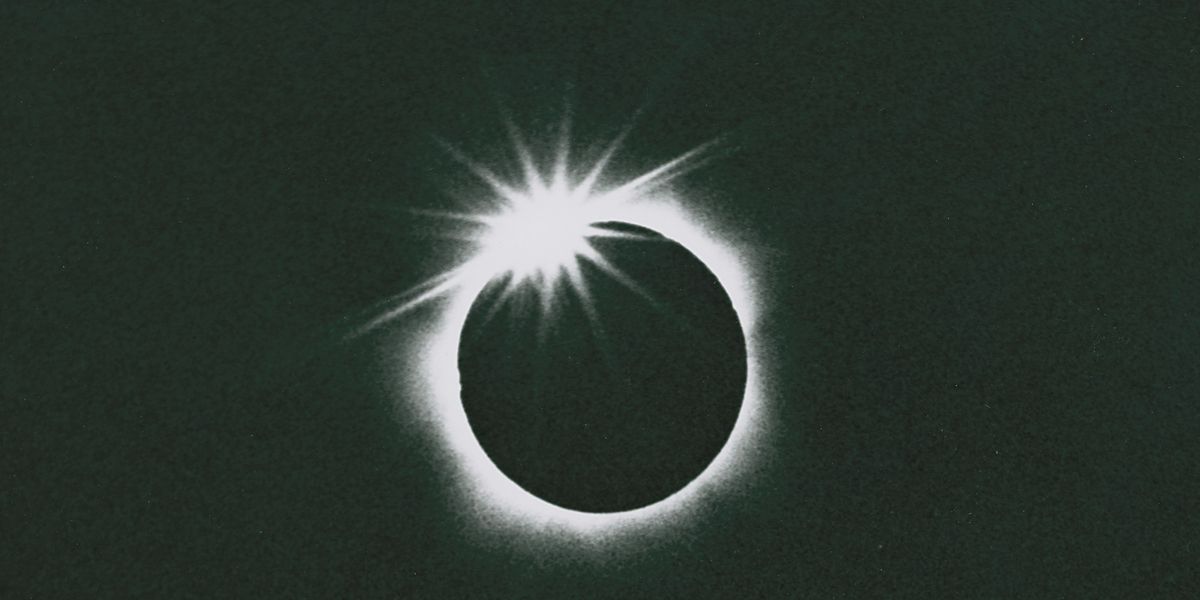 A total solar eclipse, seconds before totality, when a single bead of the sun&#039;s disk is still visible.